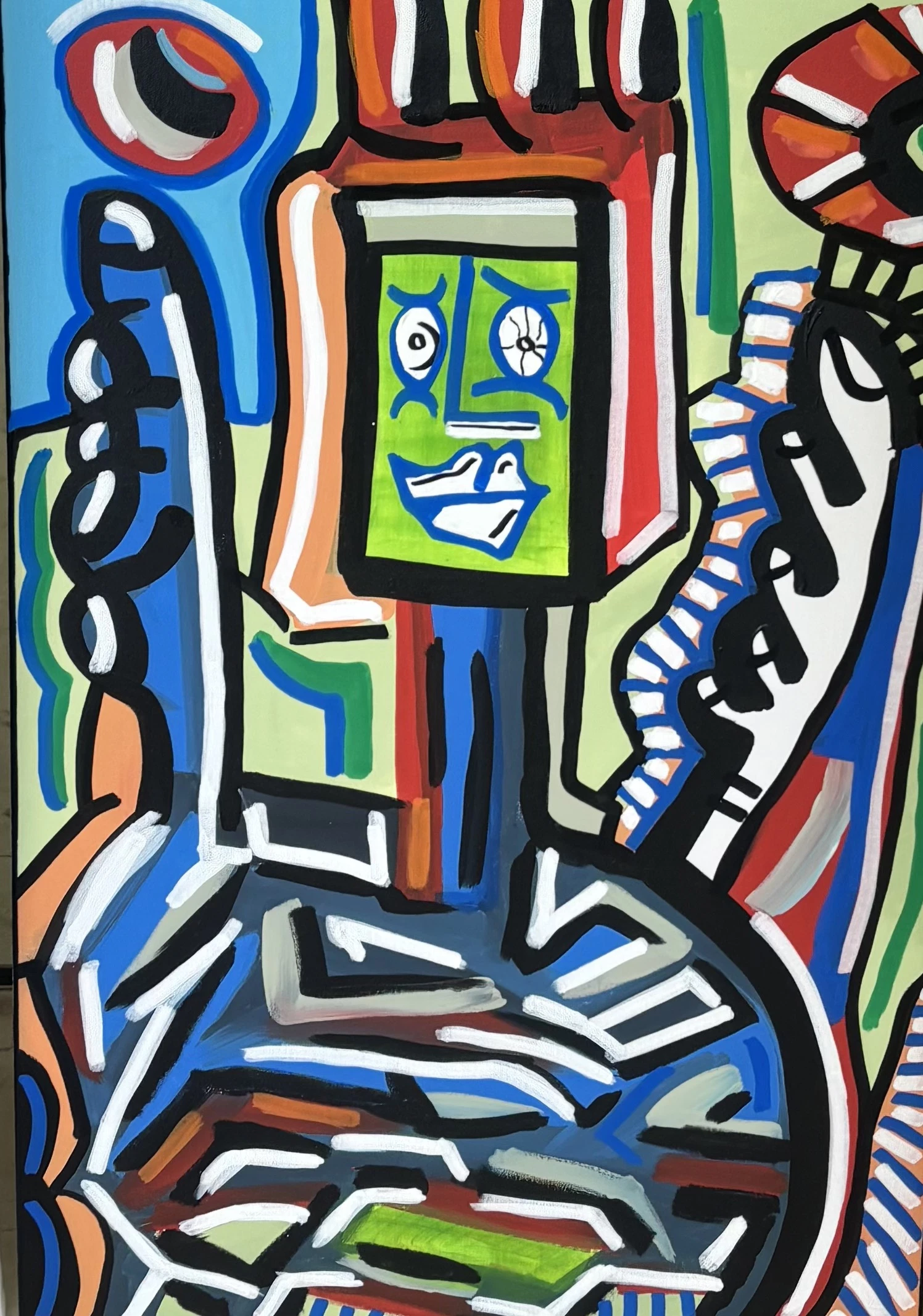 Figura de cabeza rectangular verde con ojos y boca, flanqueada por manos grandes, en rojo, azul, naranja y blanco sobre verde claro. Sin título. Acrílico sobre lienzo, 50 x 75 cm, 2026. Caracas. Nicolás Lapadula